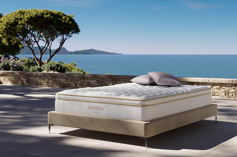 Saatva Classic, my pick for the best mattress for back pain, on a bed frame