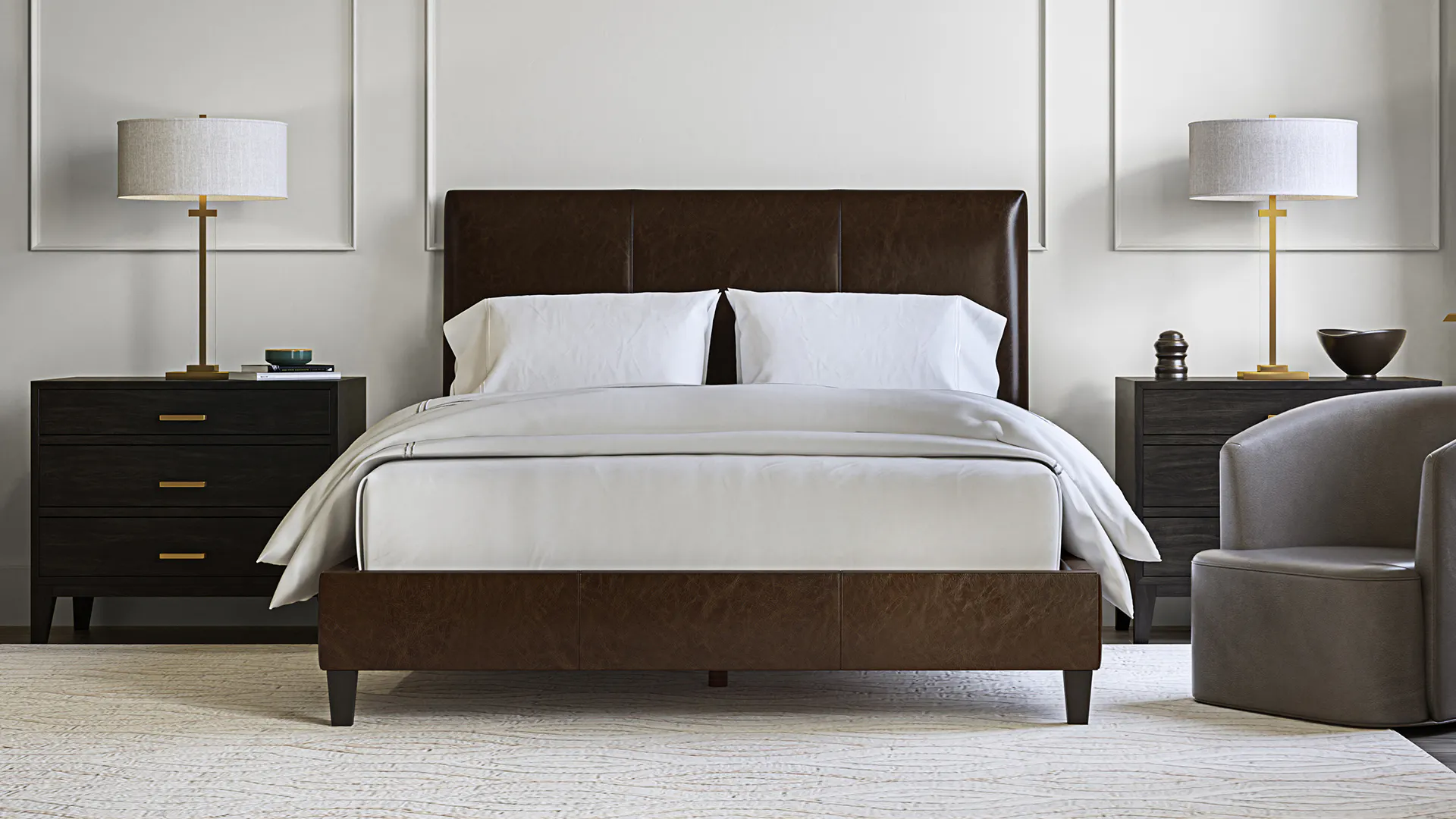 Brown leather bed with white sheets and pillows
