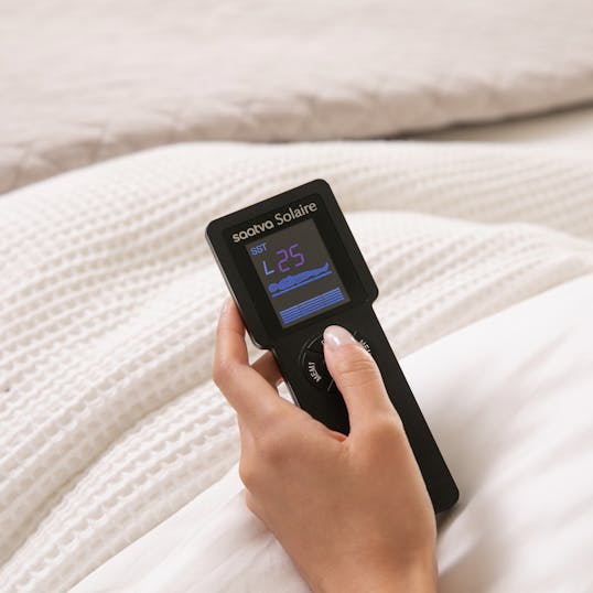 Remote resting on a blanket