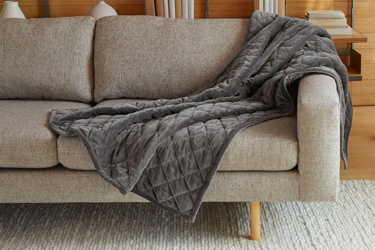 Weighted Blanket on sofa draped